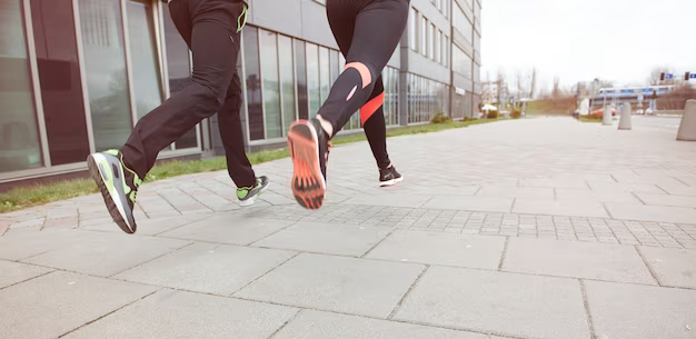 Close-up of two runners in the city