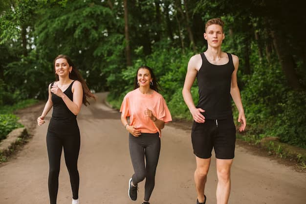 A group of people running along a path in the forest