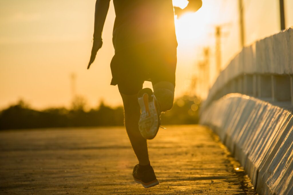 Close up of man running on sunrise