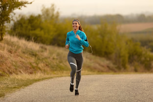 Girl running along the road in the morning